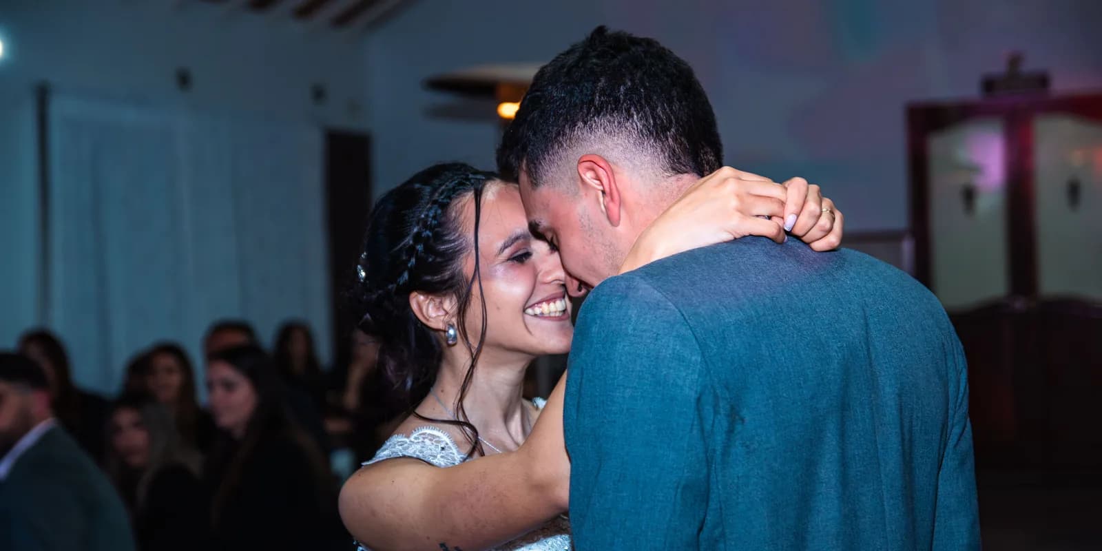 The couple's first dance, photographed from among the guests